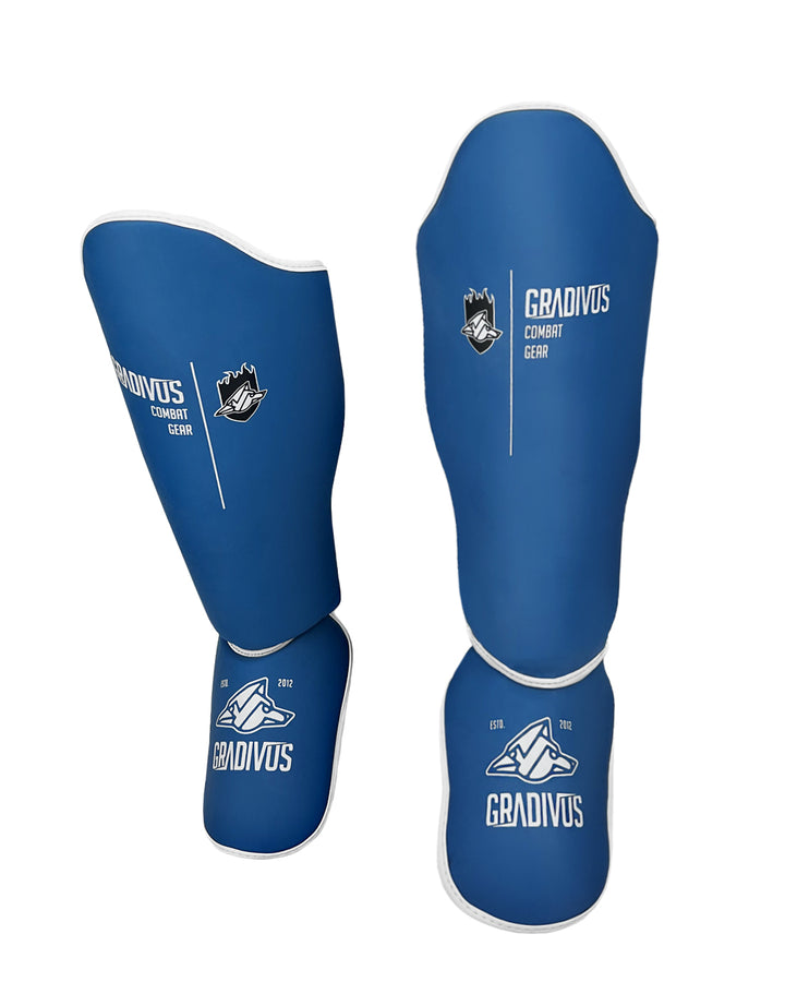 canilleras kick pro std mars gradivus kickboxing muay thai k1 sambo mma ufc bellator gimnasio academia artes de marte emblema animales sagrados azul blanco
