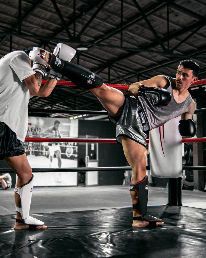 canilleras kick pro std mars gradivus kickboxing muay thai k1 sambo mma ufc bellator gimnasio academia artes de marte emblema animales sagrados negro rojo blanco